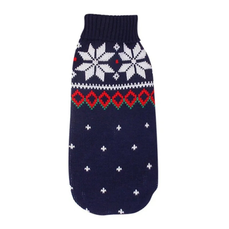 Navy blue dog sweater with white snowflakes and red patterns on a white background